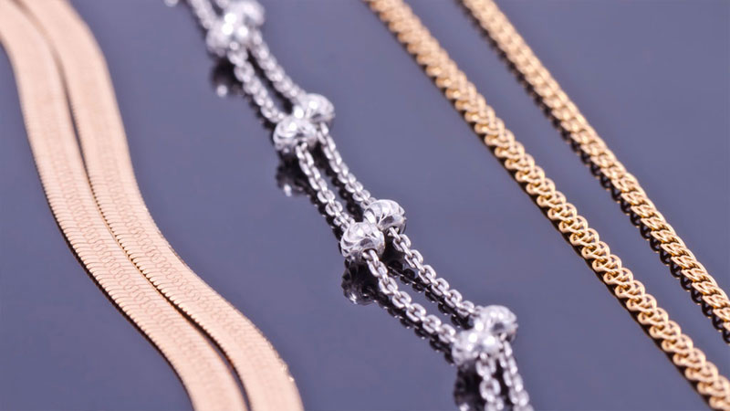 A selection of rose, white, and yellow gold necklace chains