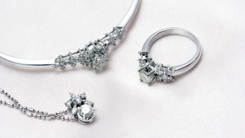 Platinum diamond engagement ring, bracelet, and pendant