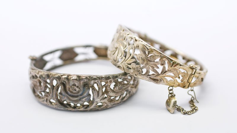Tarnished vintage silver jewellery bracelets (silver jewellery can tarnish upon exposure to sulfur and moisture)