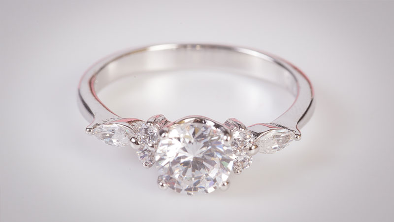 Diamond engagement ring jewellery with a rhodium coating that makes it appear brighter vs. white gold that's unplated.