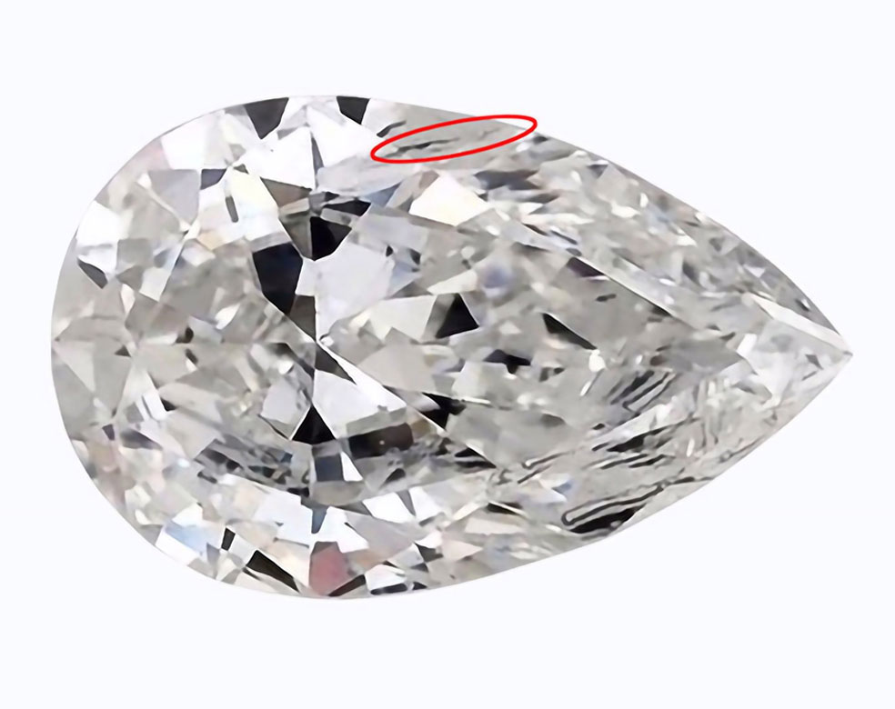 A diamond with an inclusion at the girdle.