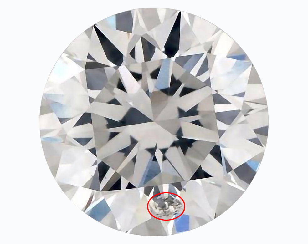 A diamond showing large inclusions that affect its diamond clarity rating.