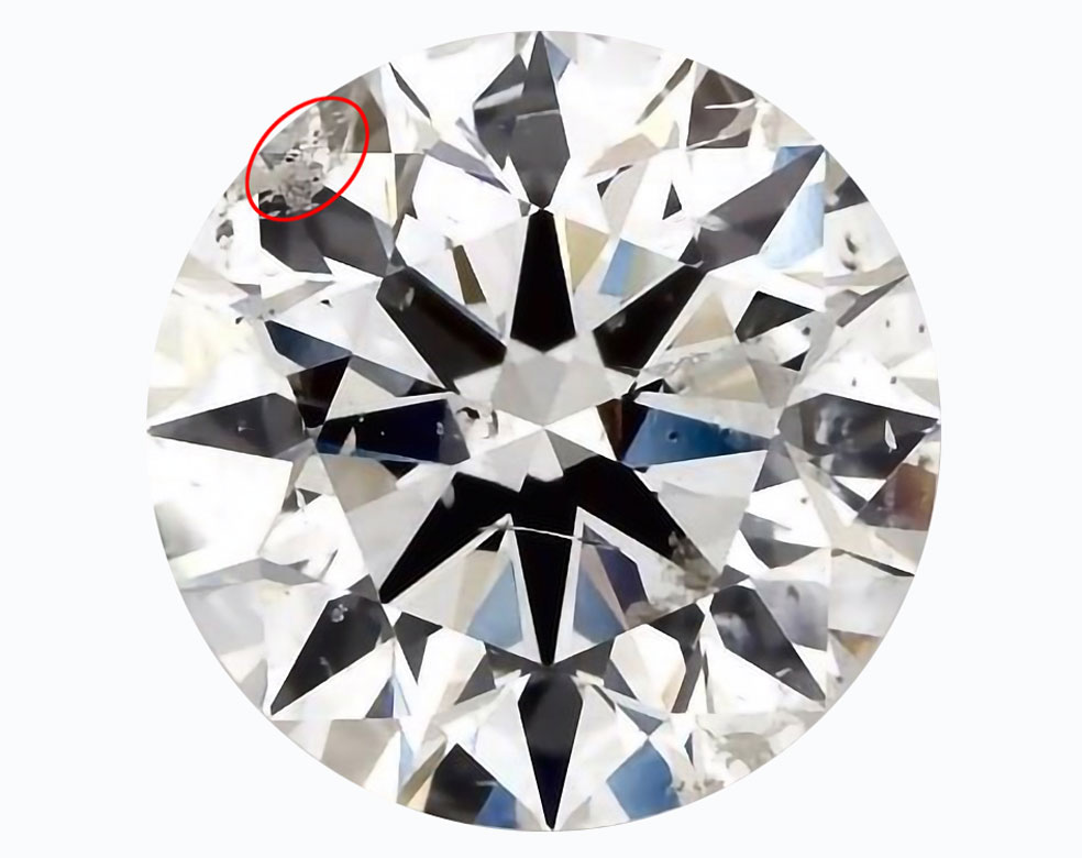 An SI clarity diamond with surface-breaking inclusions.