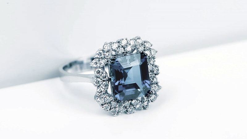 An engagement ring with fancy blue diamond center stone.