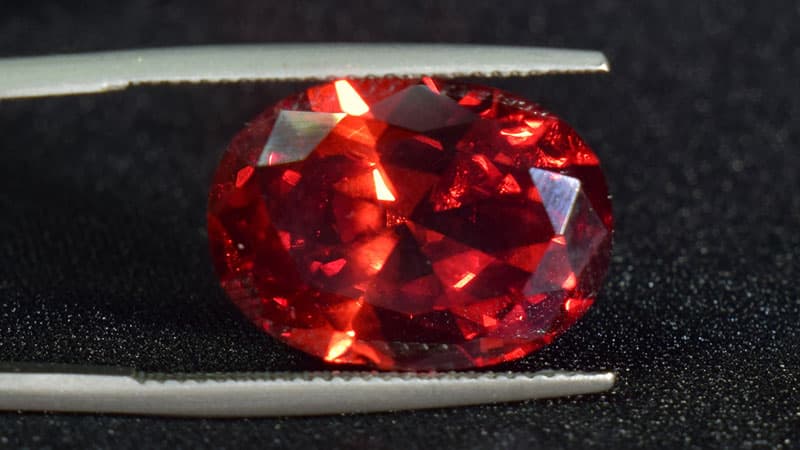 A dark red ruby with an orange undertone from Madagascar.
