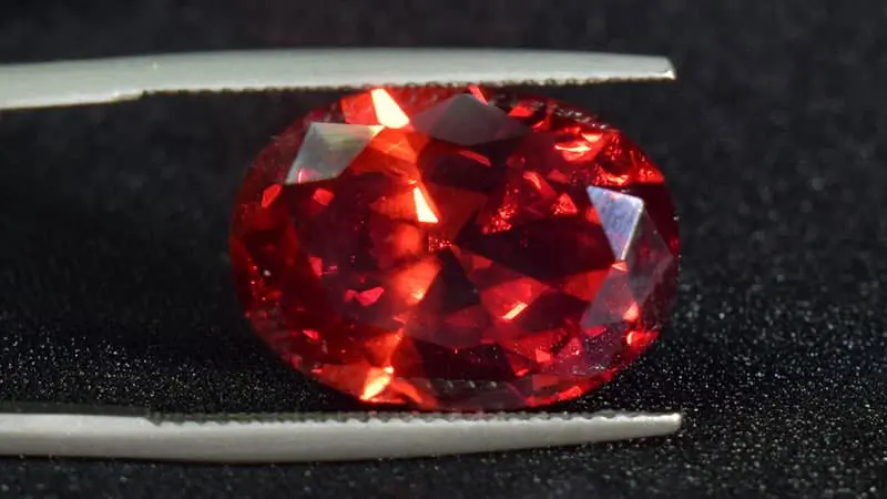 A dark red ruby with an orange undertone from Madagascar.