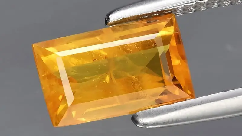 A reddish-orange sapphire.