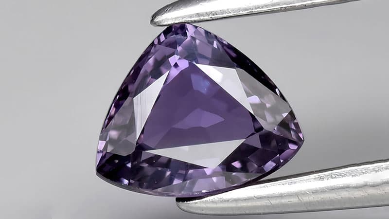 A purple sapphire with a well-formed crystal structure.