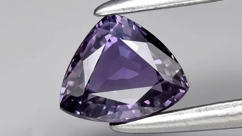 A purple sapphire with a well-formed crystal structure.