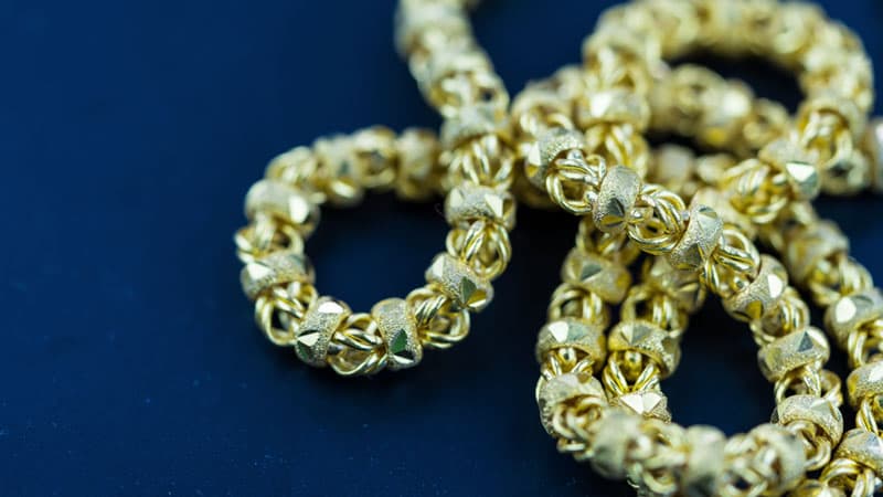 Gold necklace with green tint