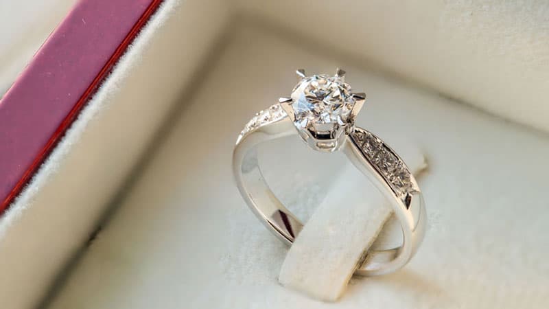 A solitaire diamond ring in a box