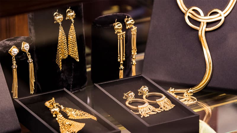 10k, 14k, 18k and 24k gold necklaces and other fine jewelry displayed in a jewelry store